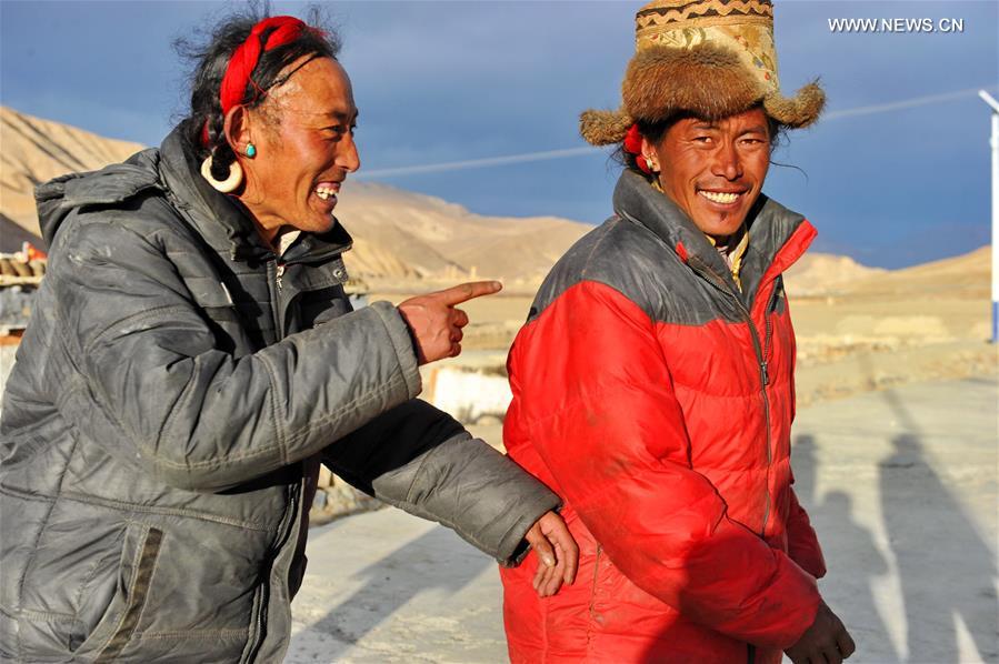 Villagers gather to dance 