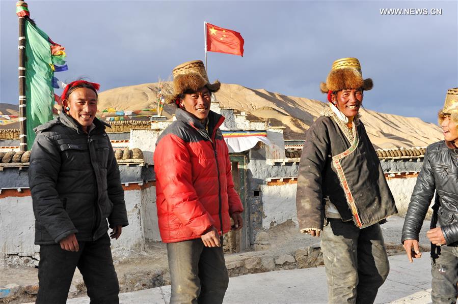 Villagers gather to dance 