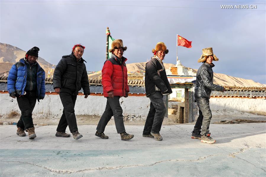 Villagers gather to dance 