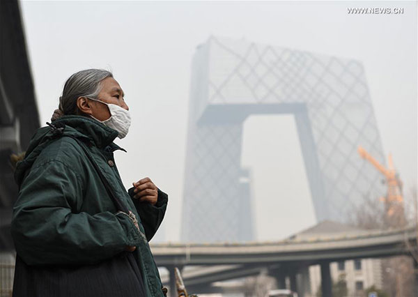 China maintains yellow alert for smog