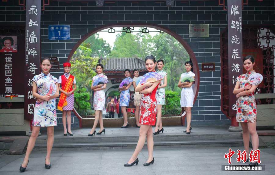 Stewardesses-to-be present traditional <EM>Qipao</EM> in SW China