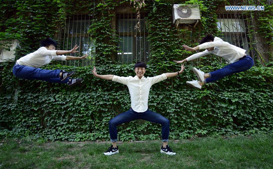 Students pose for graduation photo with performance