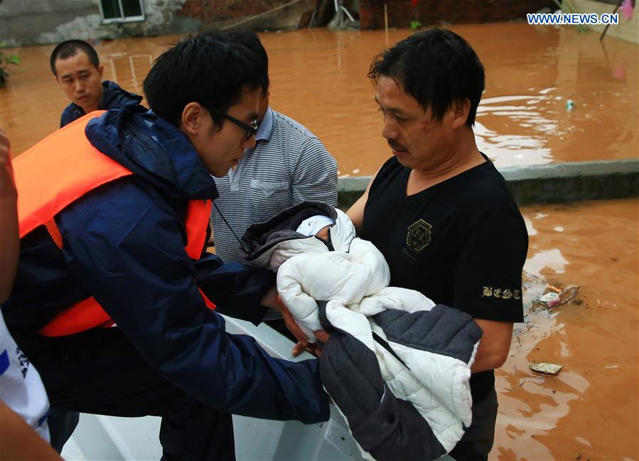 13 dead, 13 missing in China rain, landslides