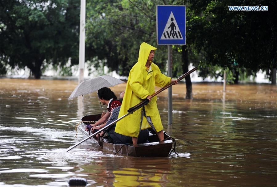 13 dead, 13 missing in China rain, landslides