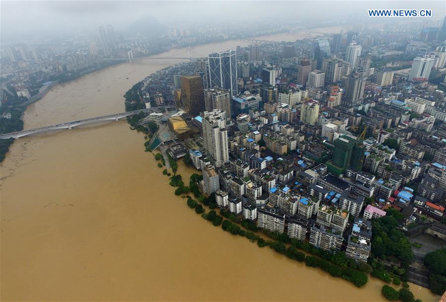 13 dead, 13 missing in China rain, landslides