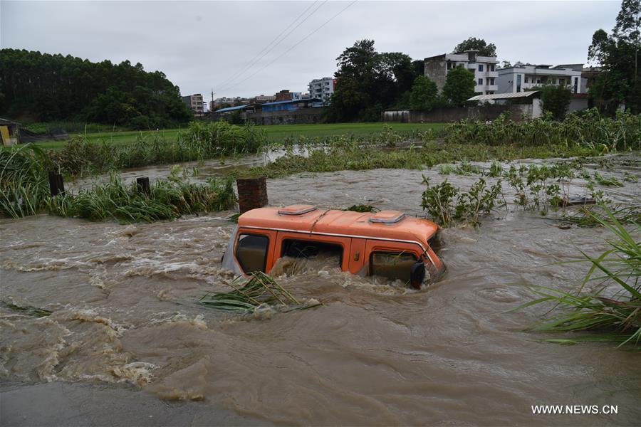 13 dead, 13 missing in China rain, landslides