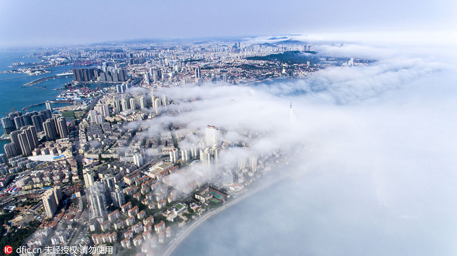 Rising above the clouds: Mist envelops Qingdao