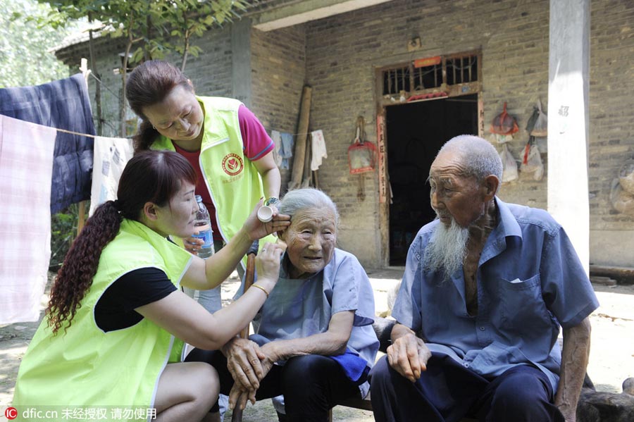 Centenarian couple embrace diamond wedding anniversary