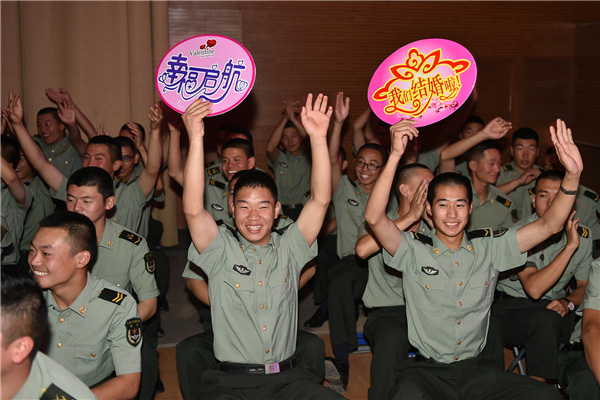 Couples exchange 'bullet shell rings' at group wedding in military camp