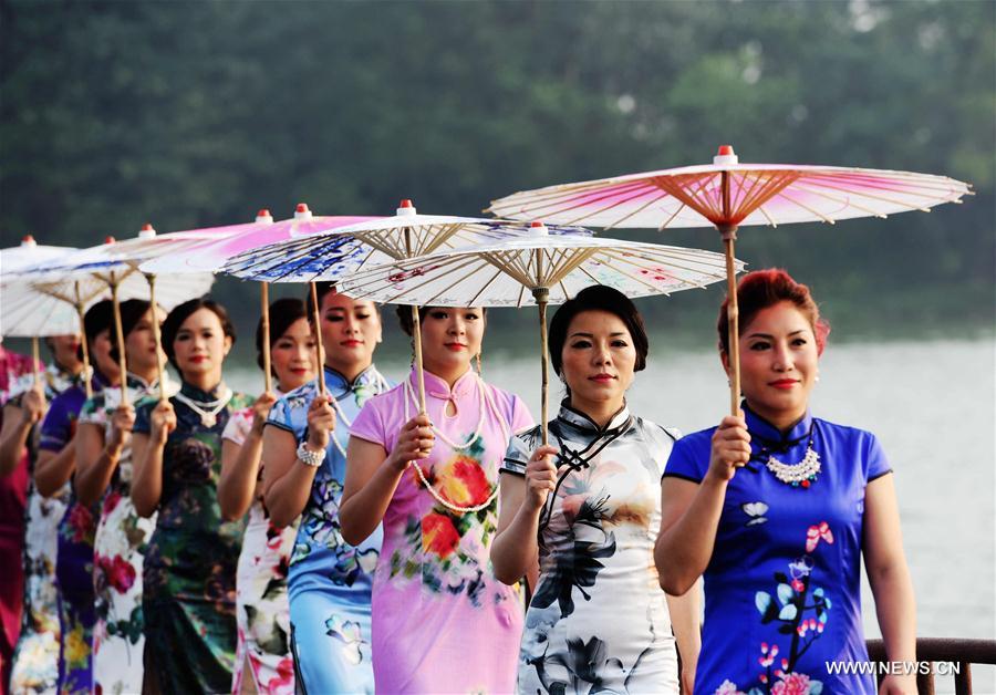 Ladies present <EM>qipao</EM> in South China's Guangxi