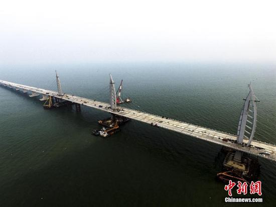 World's longest cross-sea bridge one step closer to completion