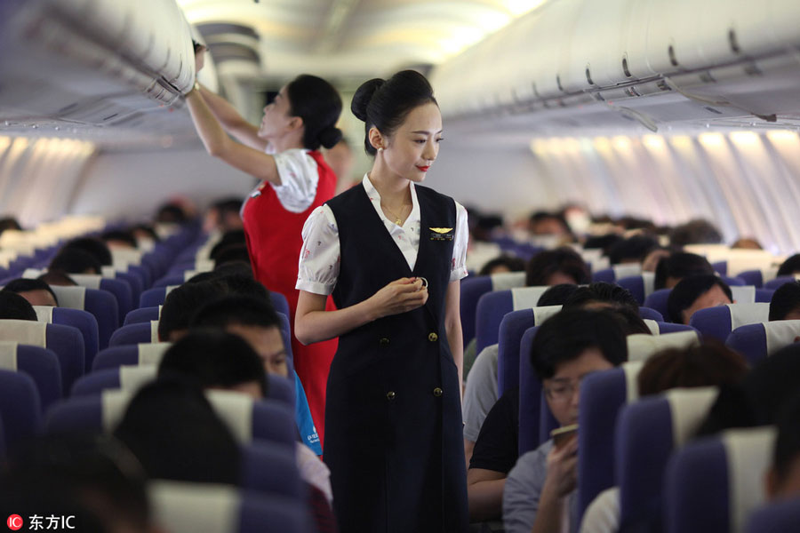 World's most beautiful stewardess: Serving passengers with smile