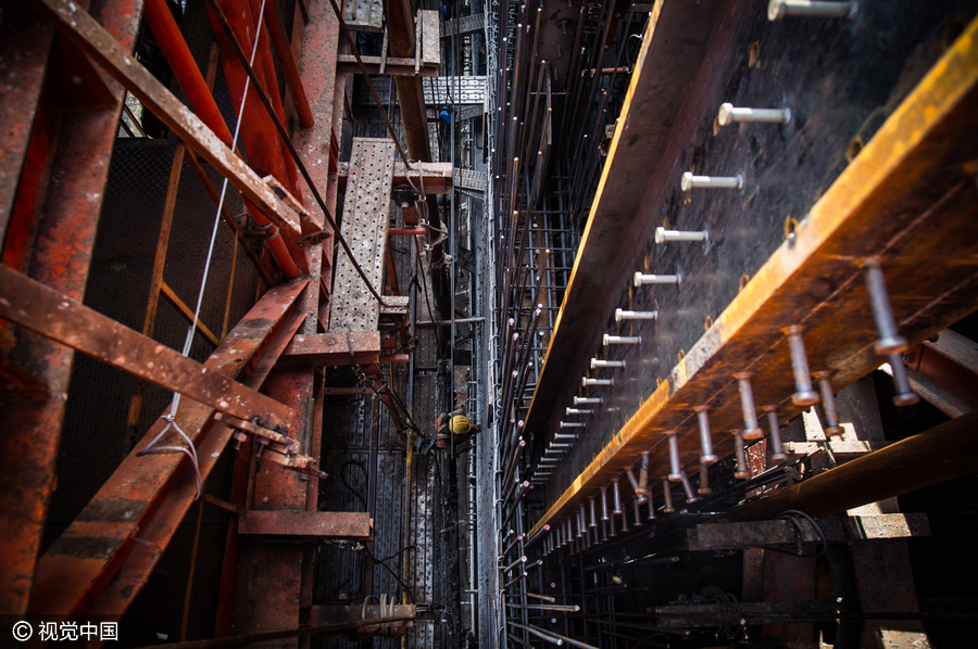 Workers behind Beijing's tallest building