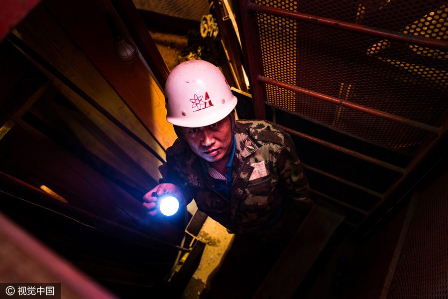 Workers behind Beijing's tallest building