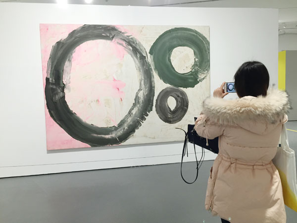 Wuhan University exhibits artwork from alumni