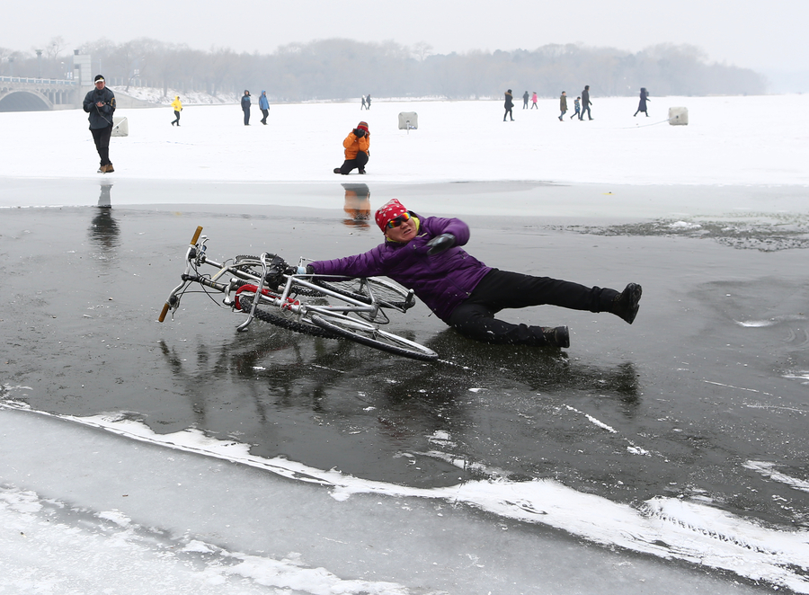 55-year-old man performs bicycle stunts on ice