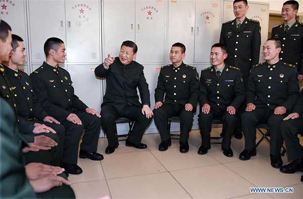 Xi urges continued efforts to build strong military