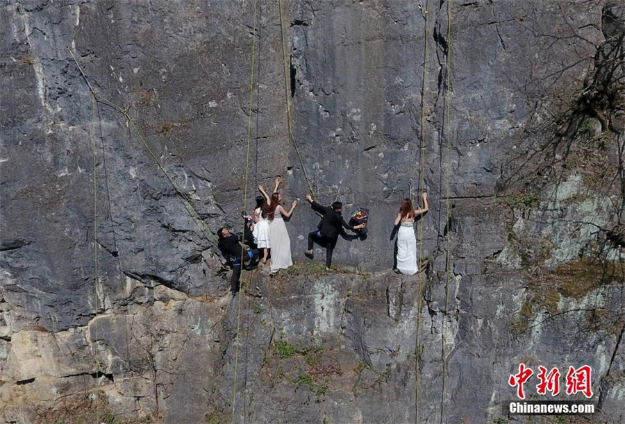 Taking love to new heights with special cliffside wedding photo