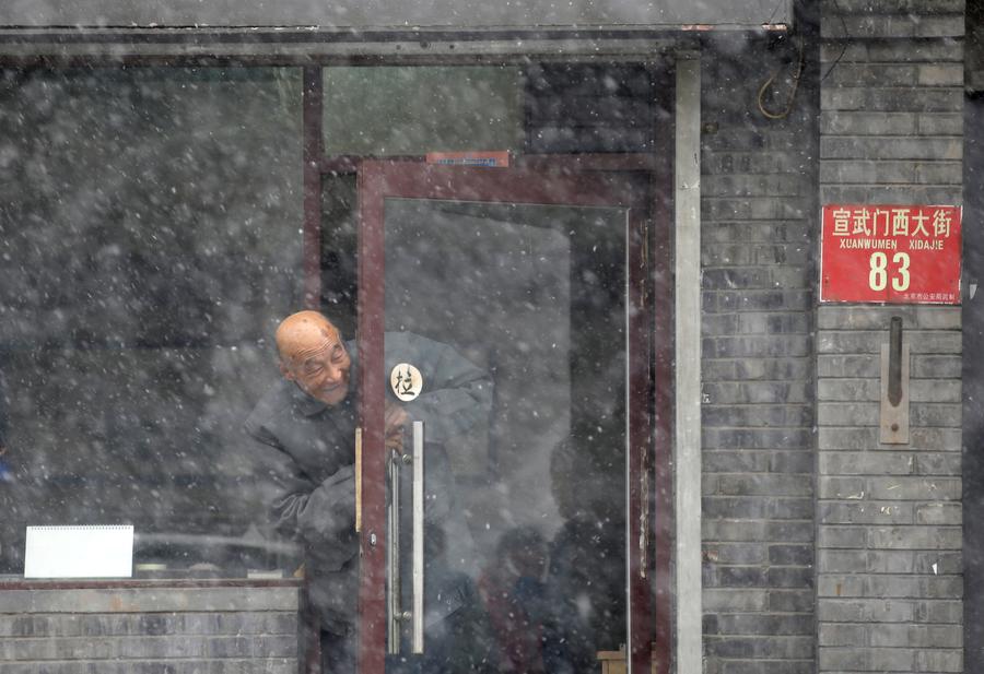 Beijing welcomes first snow in Year of the Rooster