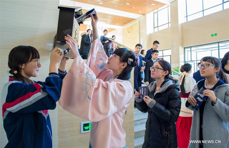 Students cheer at adult ceremony in North China