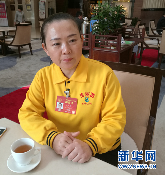 From laid-off worker to national legislator, Jiao hasn't forgotten her roots