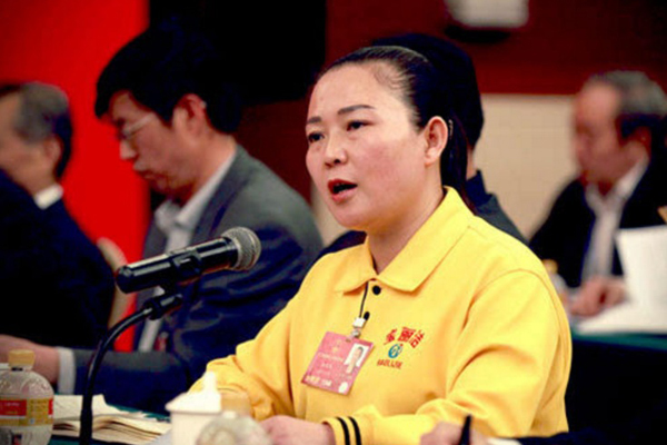 From laid-off worker to national legislator, Jiao hasn't forgotten her roots