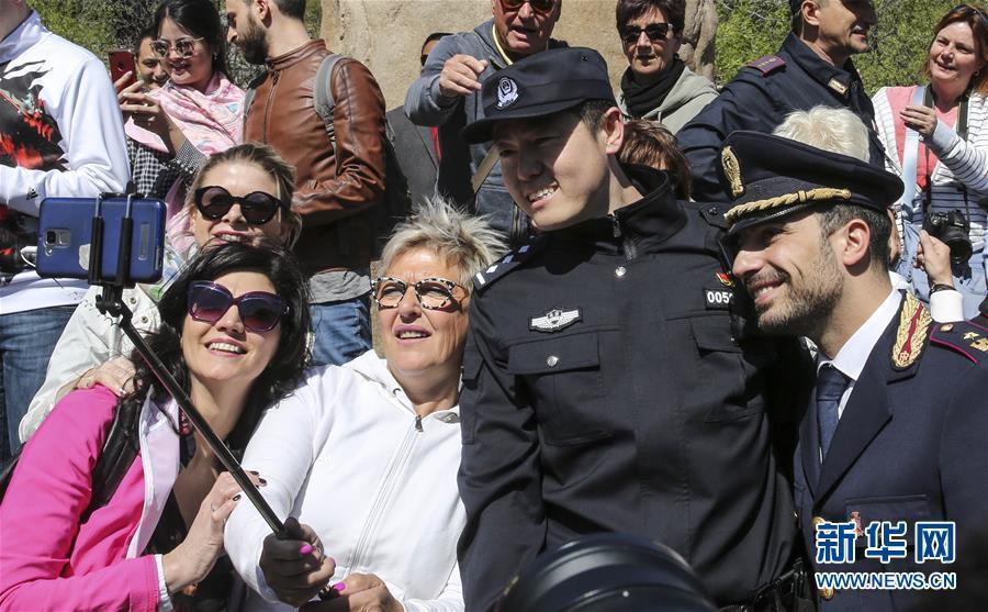 Italian police officers walk beats on Great Wall