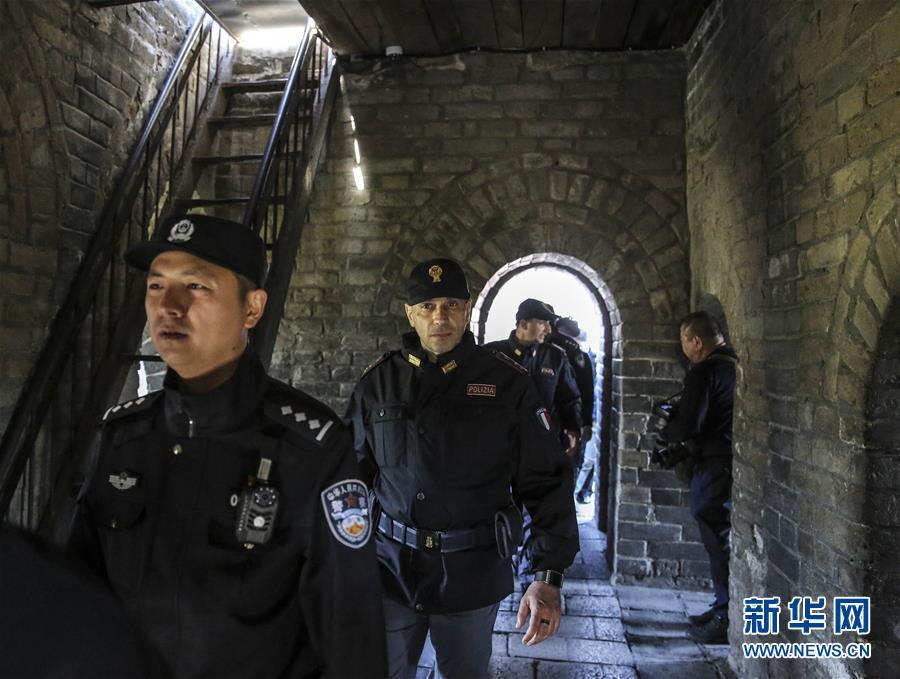 Italian police officers walk beats on Great Wall