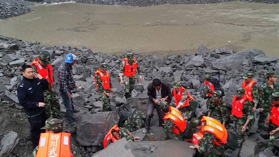 Xi urges all-out rescue effort after landslide buries 62 homes