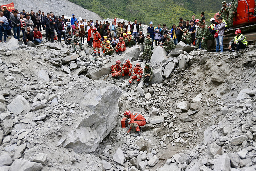 Rescue work underway after SW China's devastated landslide