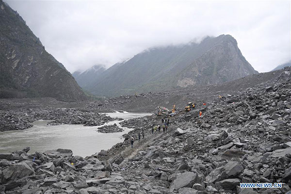 15 found dead in SW China landslide burying 120