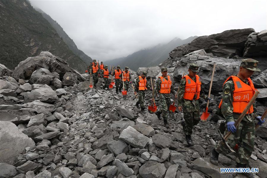 Rescue work underway after SW China's devastated landslide