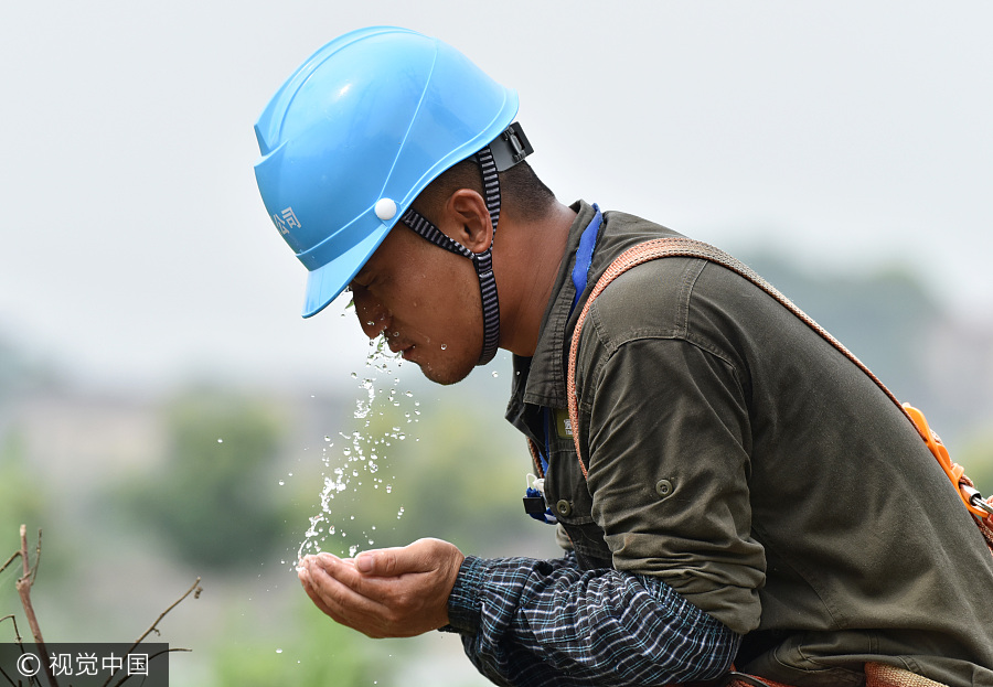 Workers stick to their job in baking sun