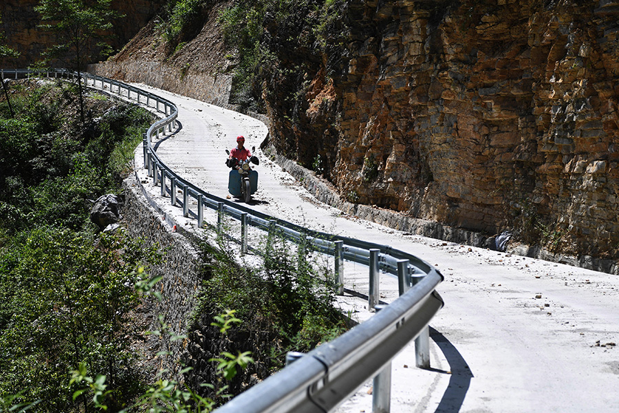Villagers create path to prosperity by carving out mountain road