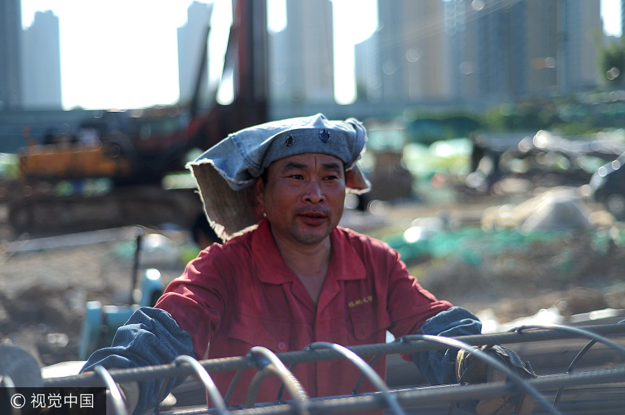 Welders cover up despite summer heat