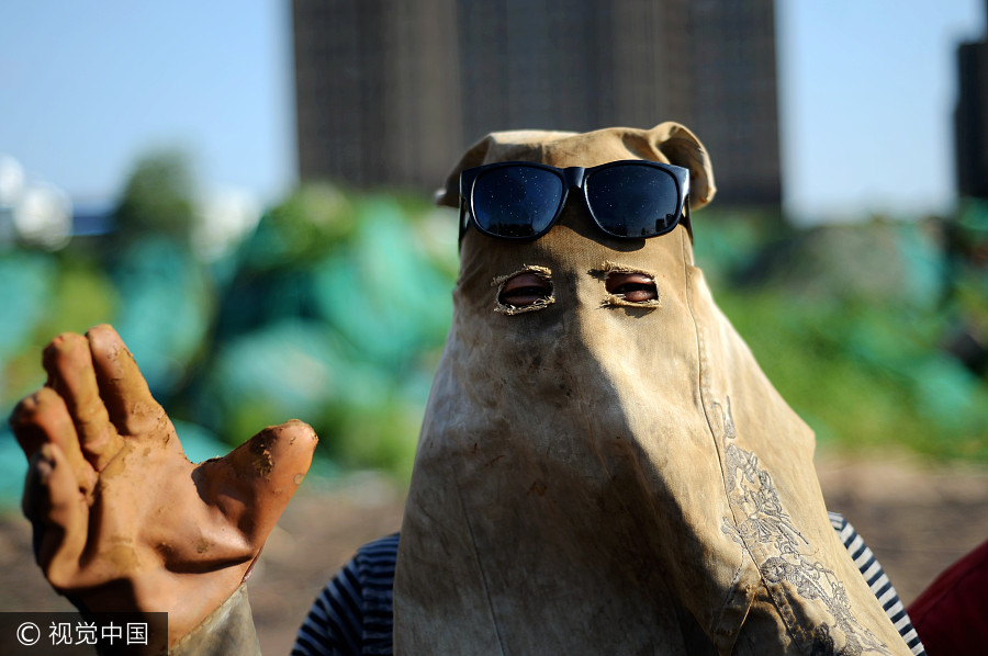 Welders cover up despite summer heat