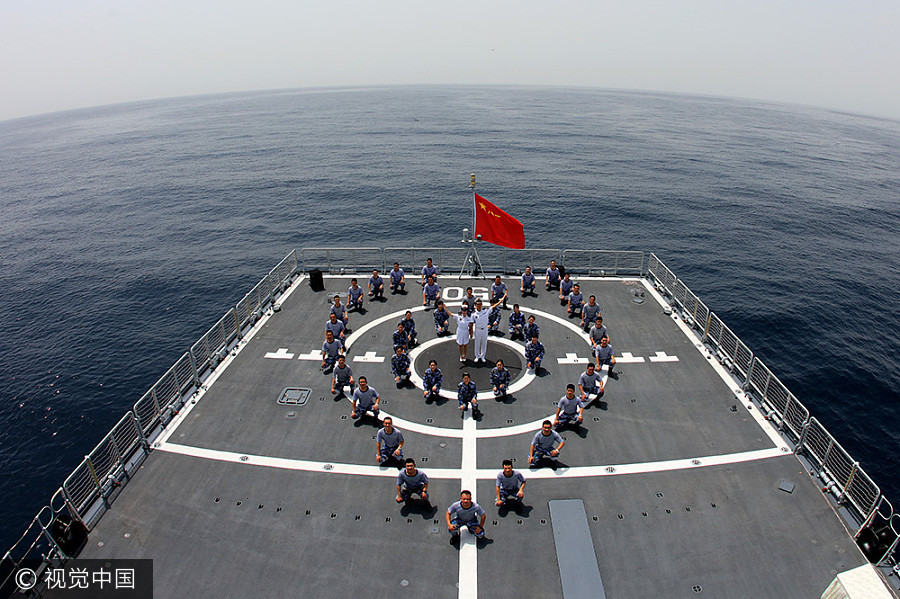 Navy sailors tie knot in middle of sea