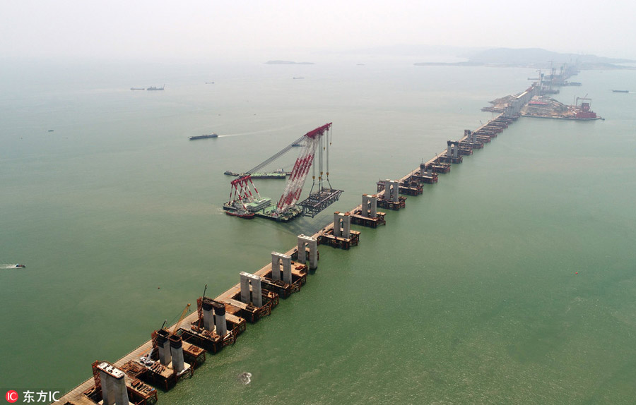 China's first cross-sea rail-road bridge takes shape