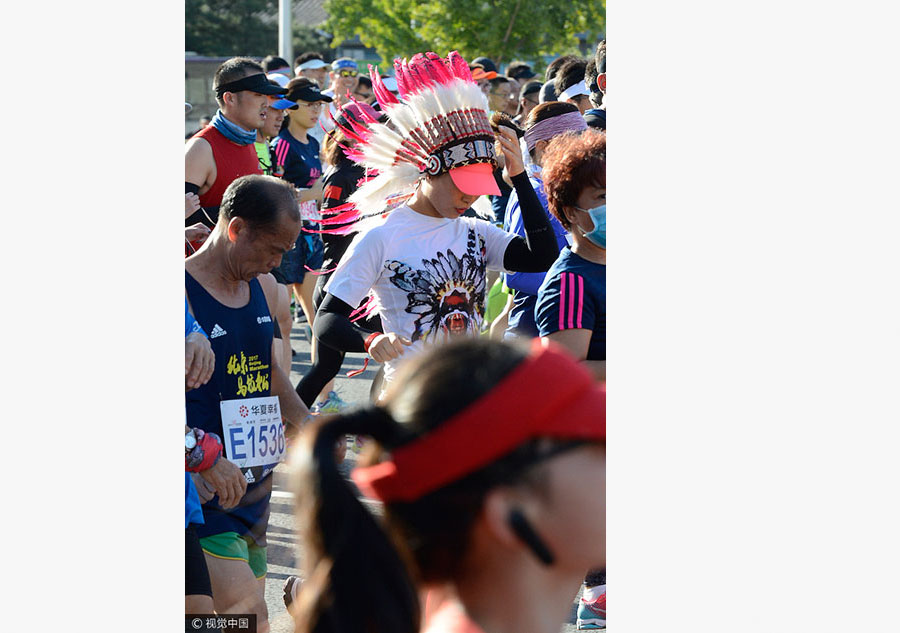 Runners compete during 2017 Beijing Marathon