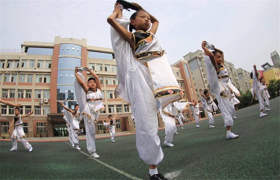 Students practice martial arts during class break