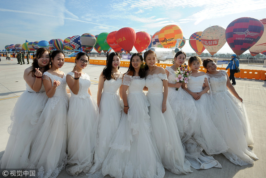 100 couples exchange vows in the air