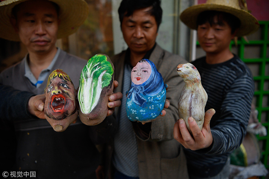 60-year-old villager paints potatoes for a living