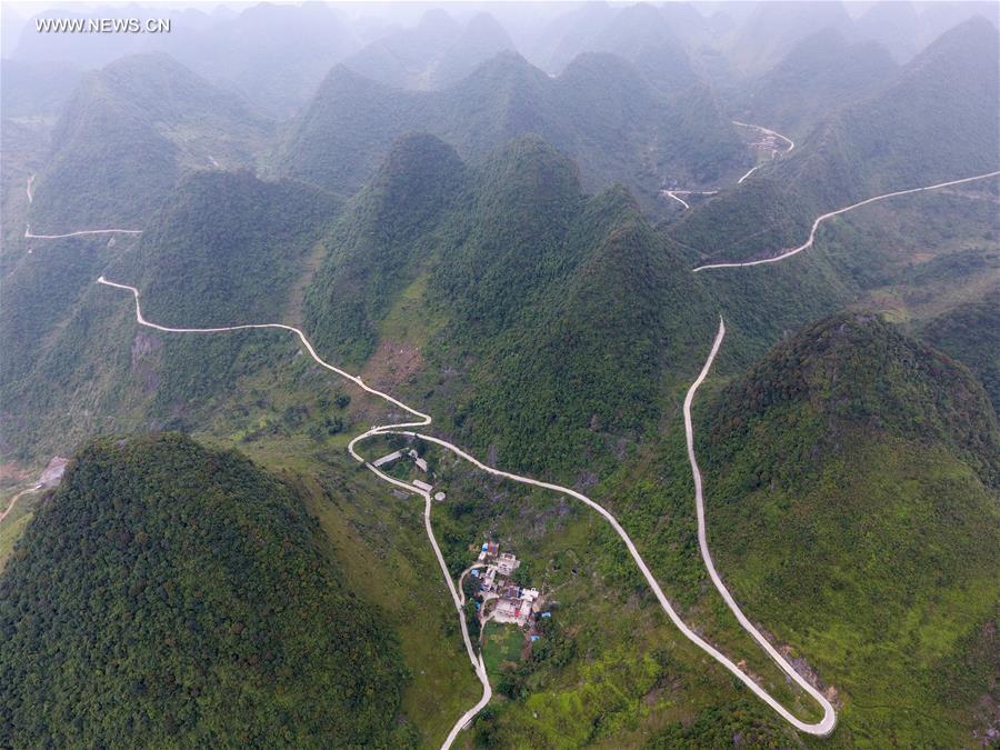 Counstruction of country roads help people to alleviate poverty in Guangxi