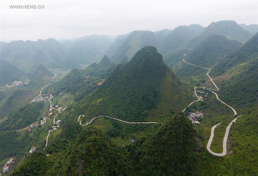 Counstruction of country roads help people to alleviate poverty in Guangxi