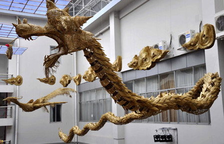 Villiagers create 30m hand-woven straw dragons, phoenixes