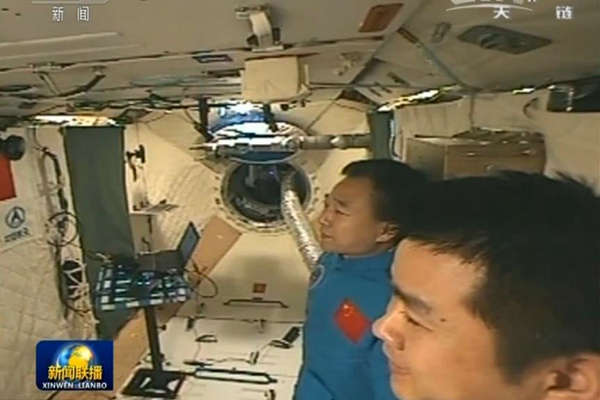 President greets orbiting astronauts in milestone video call