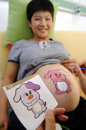 Paintings on pregnant women's bellies