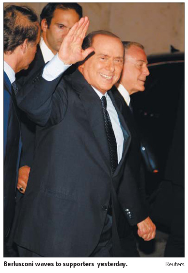 Berlusconi vows to stay on despite court setback