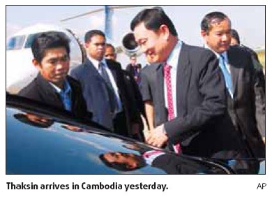 Thaksin lands in Cambodia