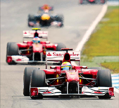 Alonso leads controversial Ferrari 1-2